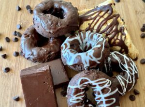 Assorted chocolate pastries with chocolate dripped on